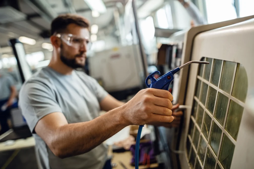 Machi Mechanical technician working on heating equipment