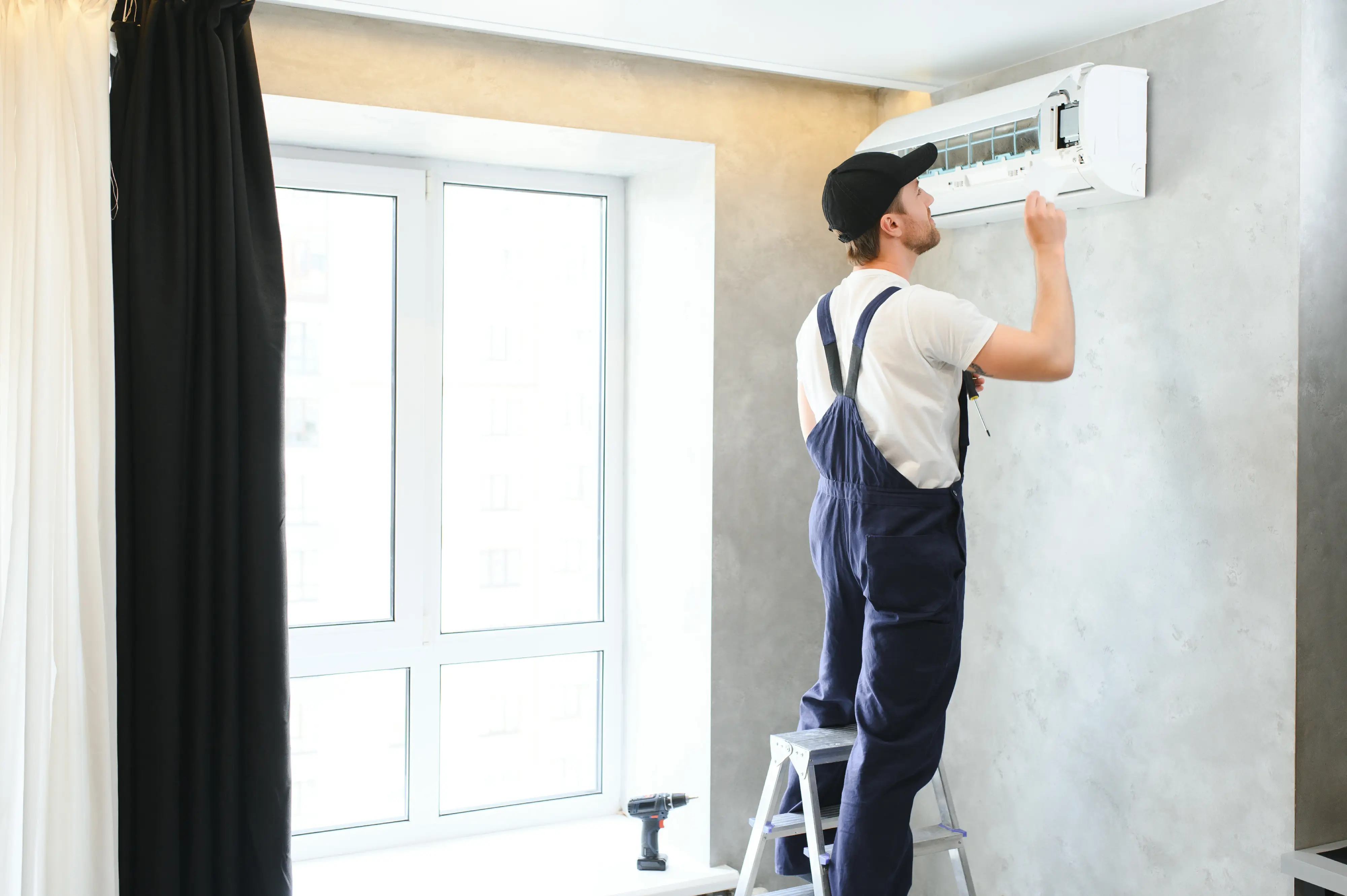 HVAC technician completing an air conditioner repair